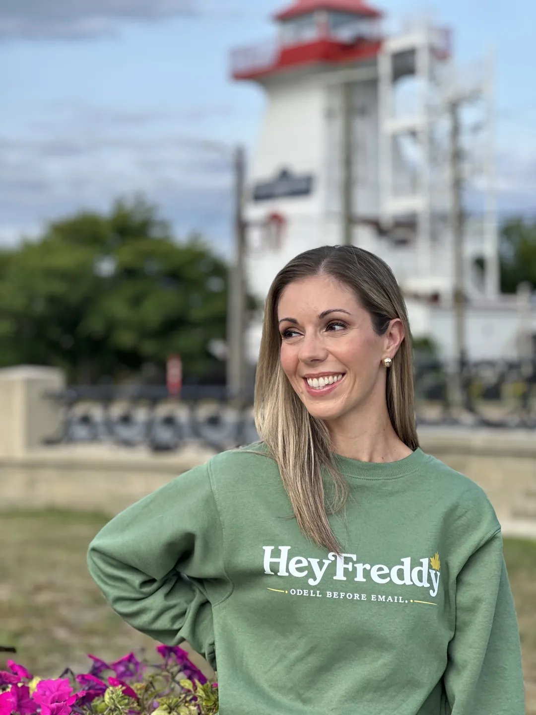 Local wearing the Hey Freddy Odell Before Email crewneck by the Fredericton lighthouse